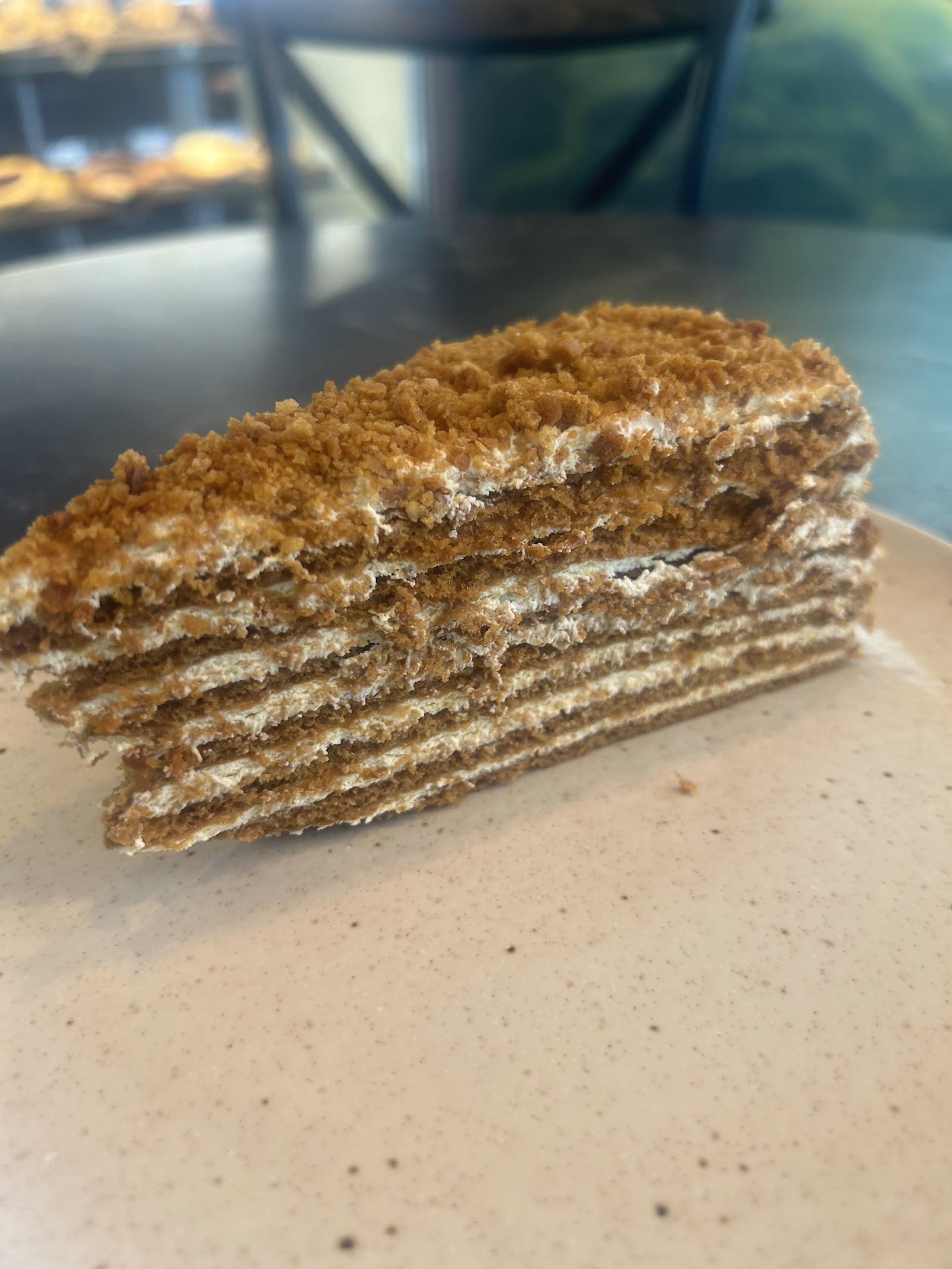 A close-up slice of honey cake showing its many thin layers